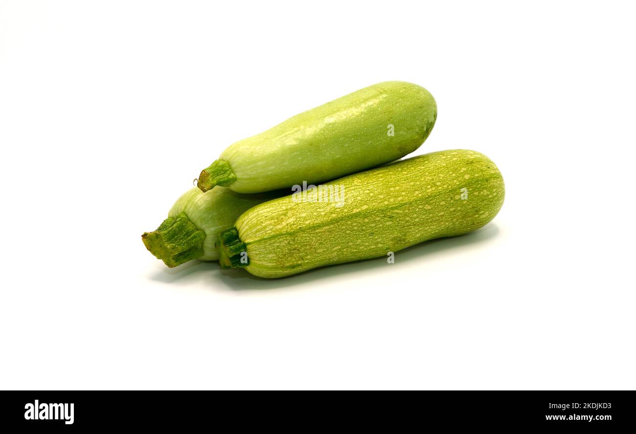 Three zucchini on a light background. Natural product. Natural color