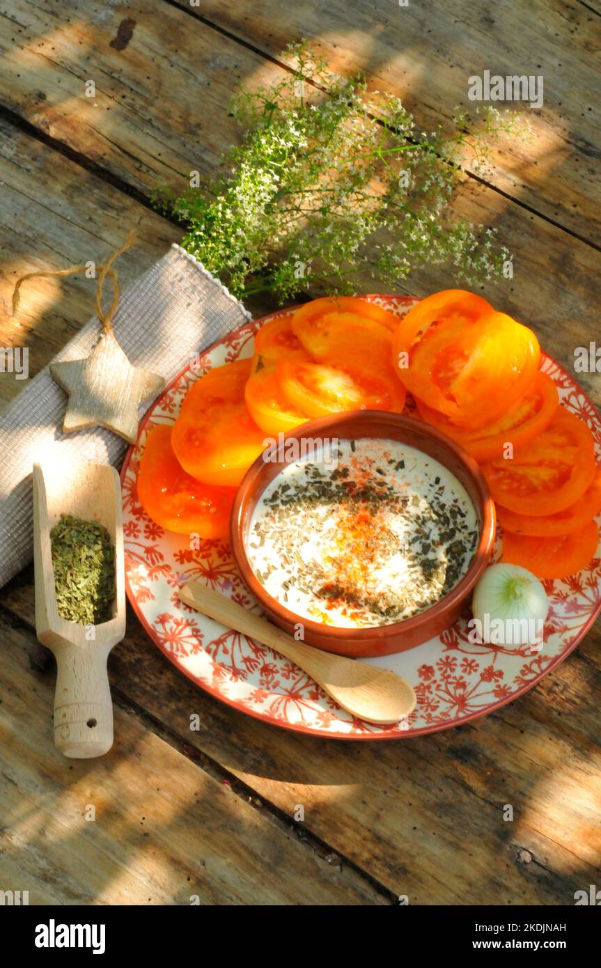 Tarragon (Artemisia dracunculus) and tomato salad, herb, benefits health, cooking in sauce for