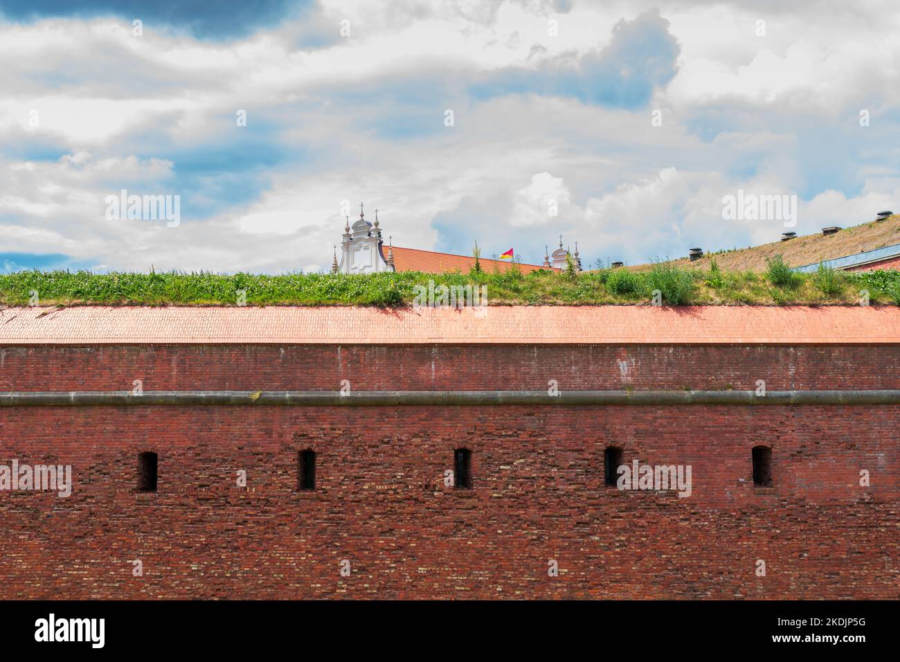 Defensive walls of the city of Zamość. Church in the background. Zamosc, Poland Stock Photo