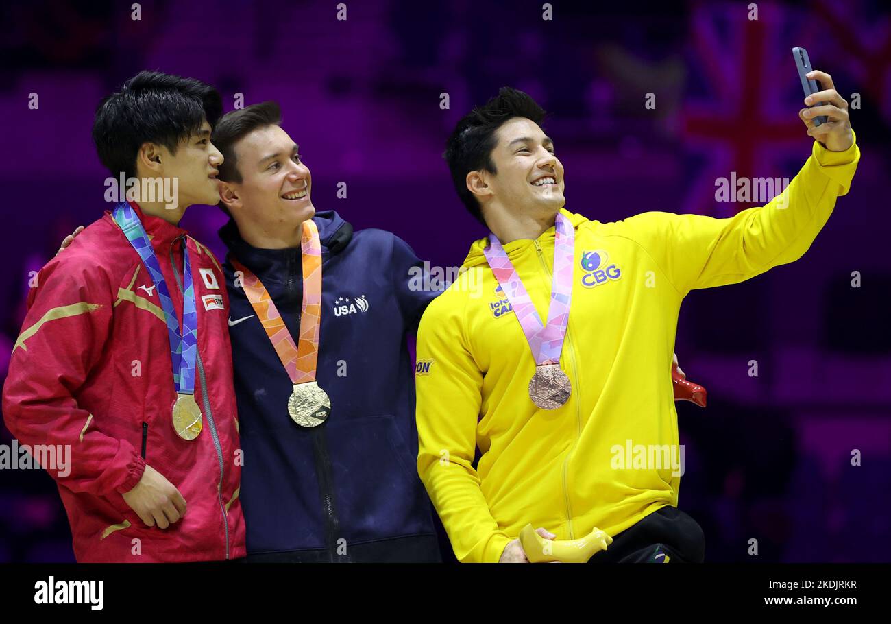 Liverpool, Britain. 6th Nov, 2022. Gold medalist Brody Malone (C) of the United States, silver medalist Hashimoto Daiki (L) of Japan, and bronze medalist Arthur Mariano of Brazil take a selfie during the awarding ceremony for the men's horizontal bar final at the 51st FIG Artistic Gymnastics World Championships in Liverpool, Britain, Nov. 6, 2022. Credit: Li Ying/Xinhua/Alamy Live News Stock Photo