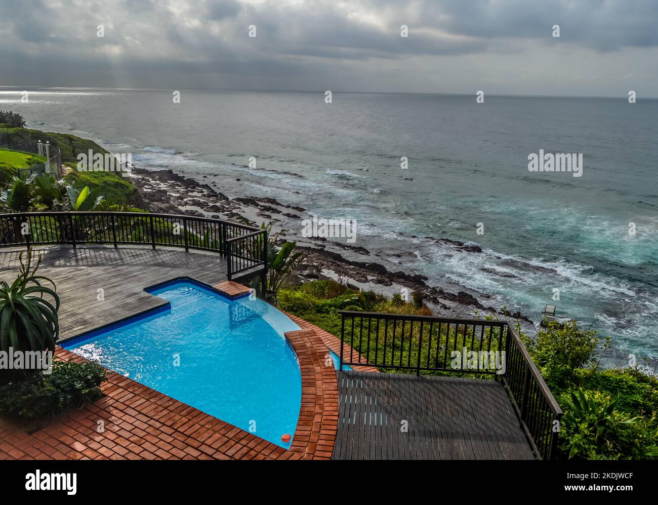 Outdoor jacuzzi and luxurious spa bath and infinity pool along Atlantic
