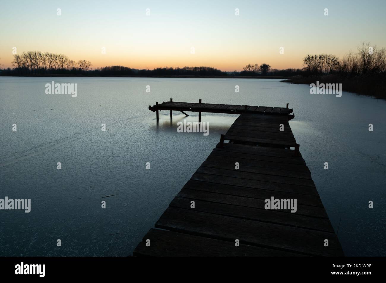 Wooden pier and a frozen lake, Stankow, Lubelskie, Poland Stock Photo