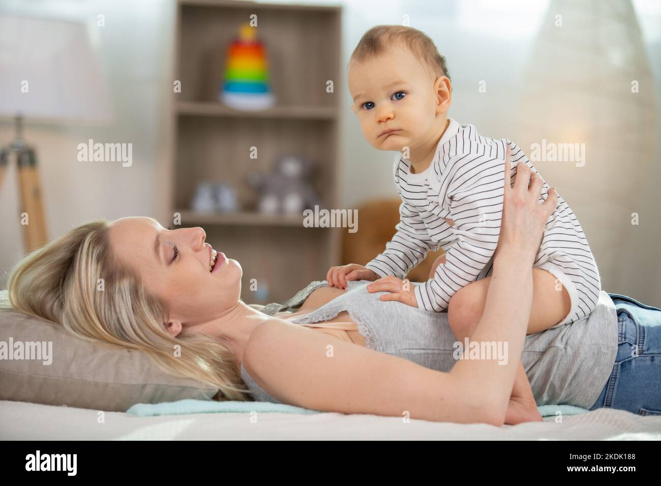 newborn baby lying on mothers stomach Stock Photo Alamy