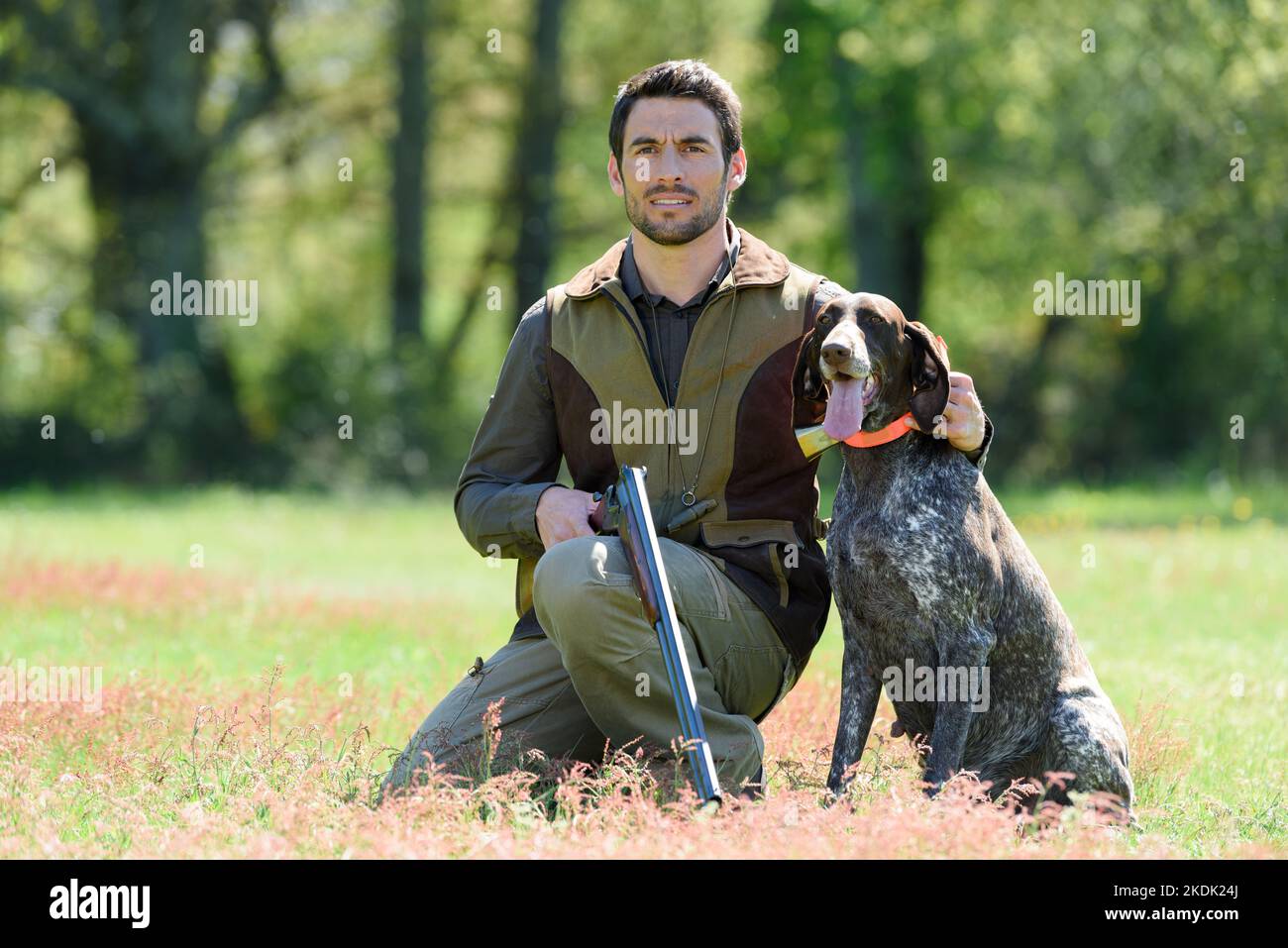 young man hunting with dog Stock Photo Alamy