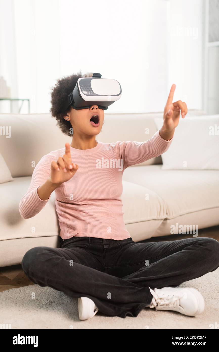 Glad shocked millennial african american woman with open mouth in