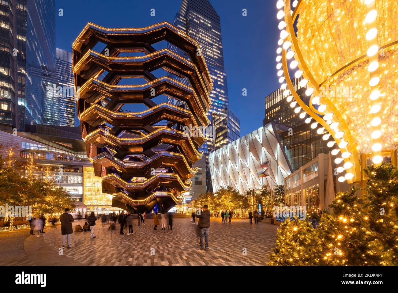Hudson Yards esplanade with The Vessel and the Shed in evening with Christmas decorations. Winter in Midtown West, Manhattan, New York City Stock Photo