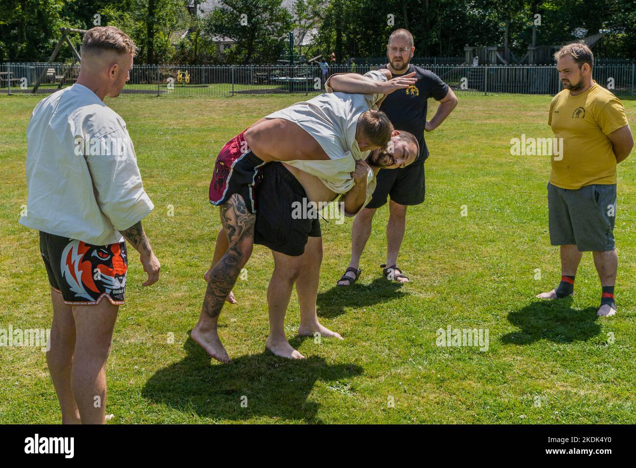 Coaches teaching the rules and techniques of Cornish Wrestling before the start of the Grand