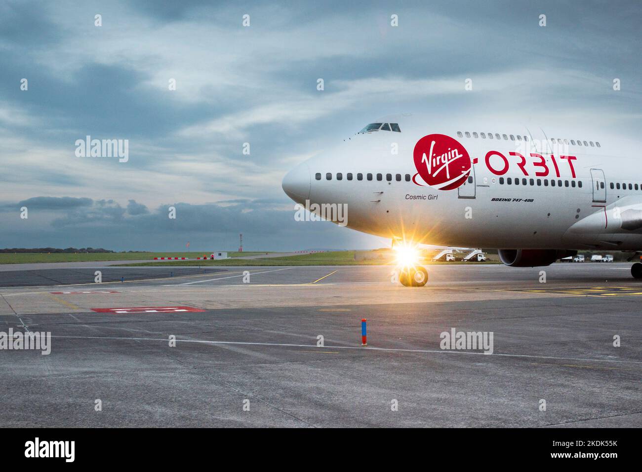 Virgin logo on the fuselage of the Virgin Orbit, Cosmic Girl, a 747-400 converted to a rocket launch platform taxiing at Spaceport Cornwall Stock Photo