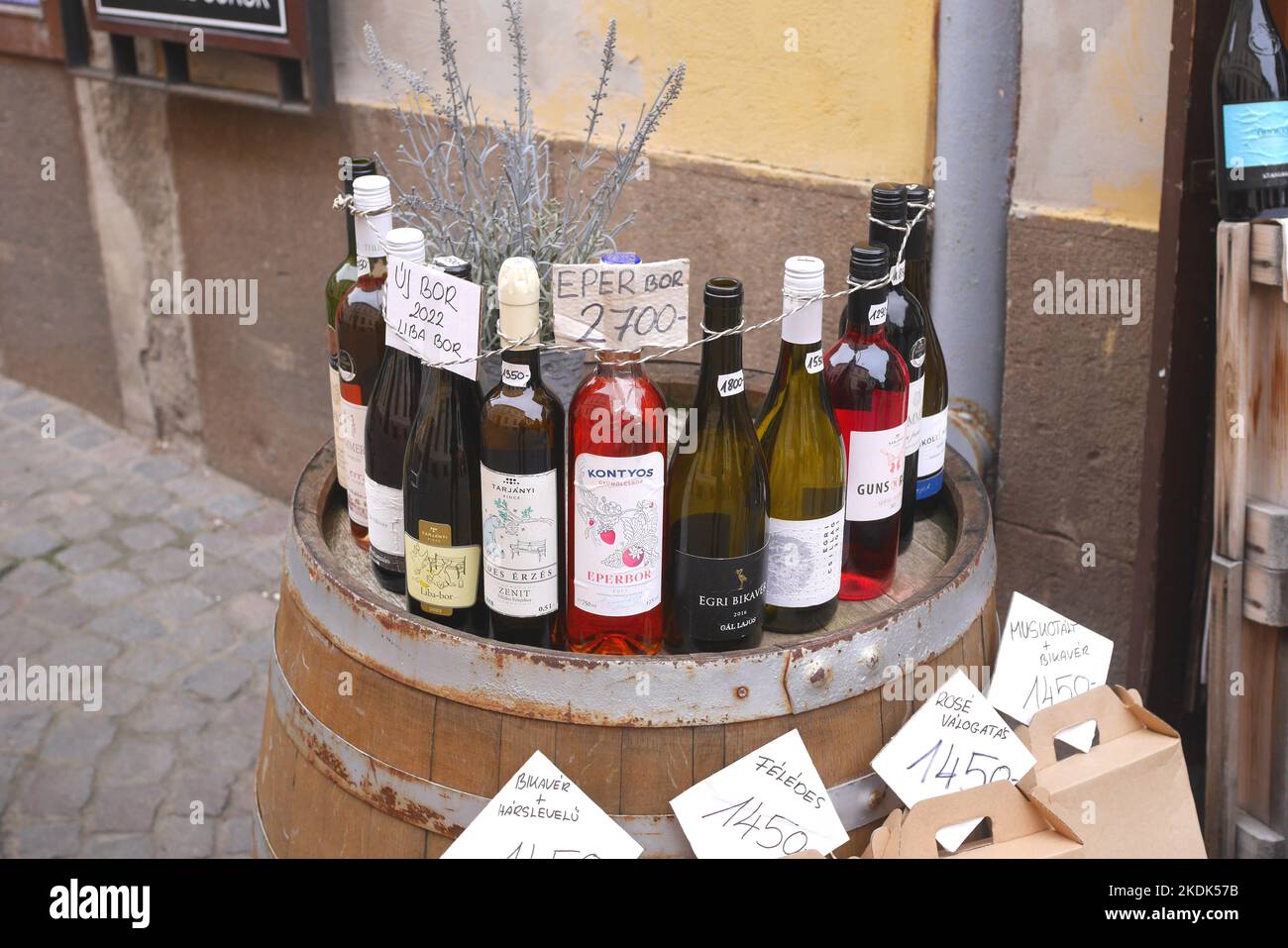 Display of wines for sale outside a traditional wine seller, Eger, Hungary Stock Photo
