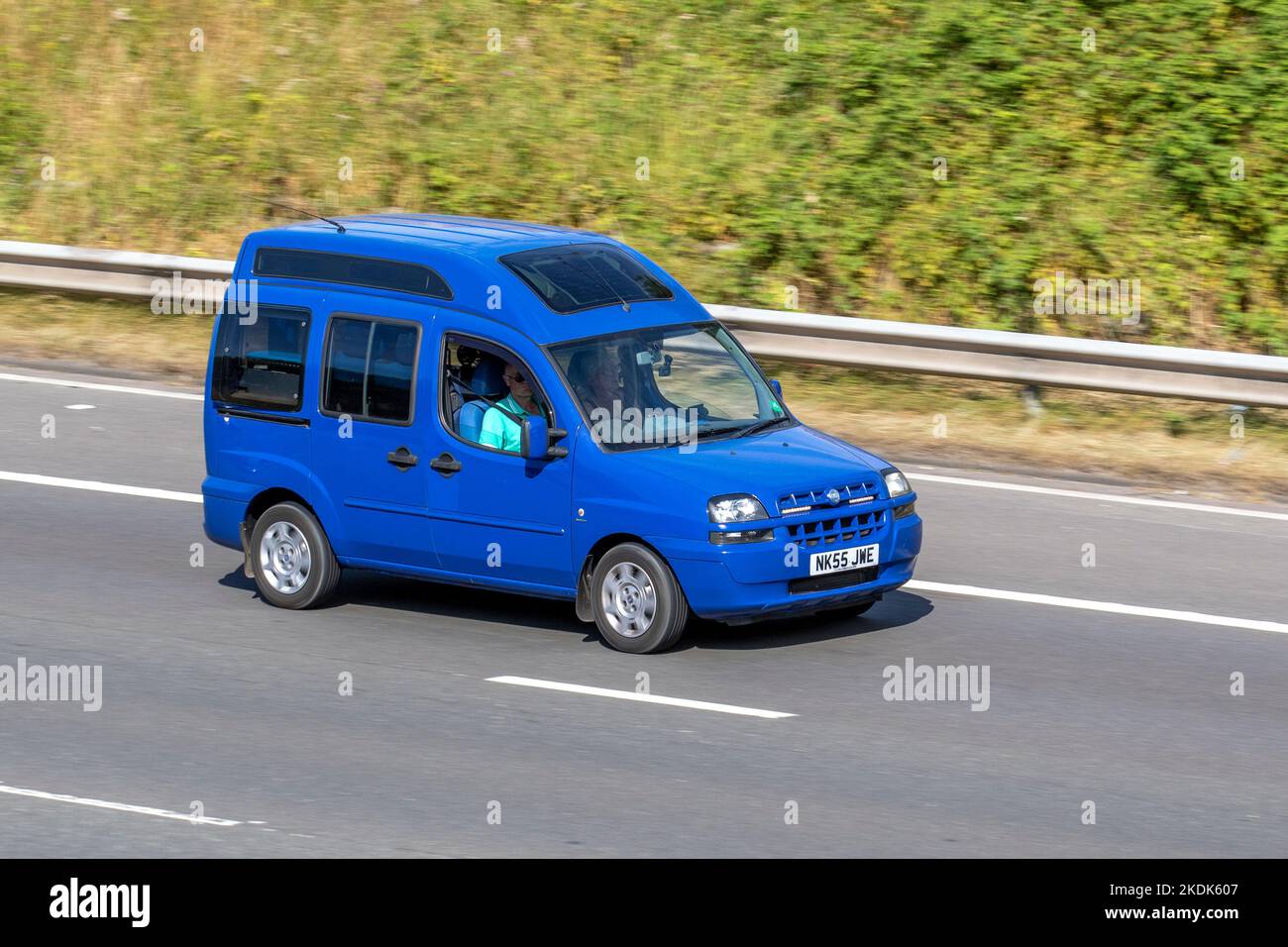 2005 blue Fiat Doblo Multijet 70 small MPV diesel car; travelling on the M6 motorway UK Stock Photo