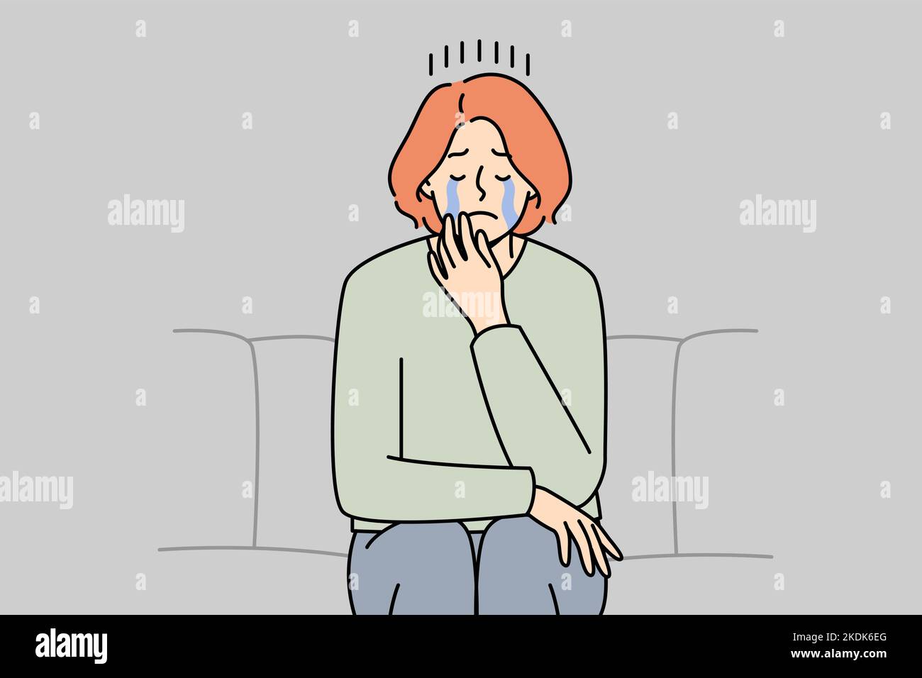 Unhappy young woman sit on couch crying suffering from depression or ...