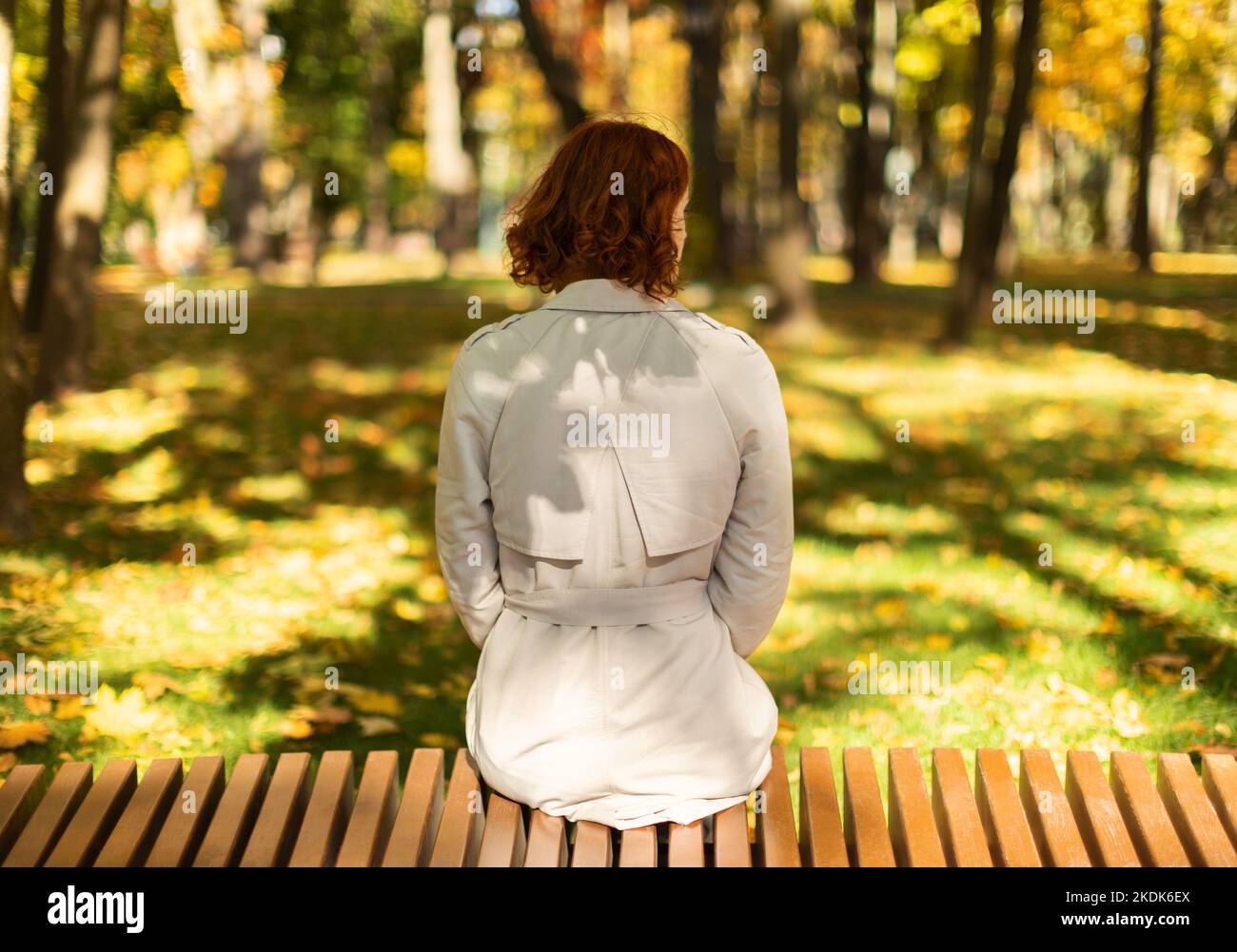 Sad young woman sits on hi-res stock photography and images - Alamy
