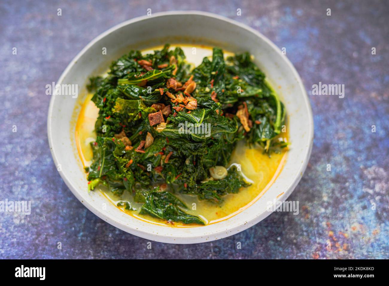 Gulai Daun kale / kale cooked with coconut milk and spices Stock Photo