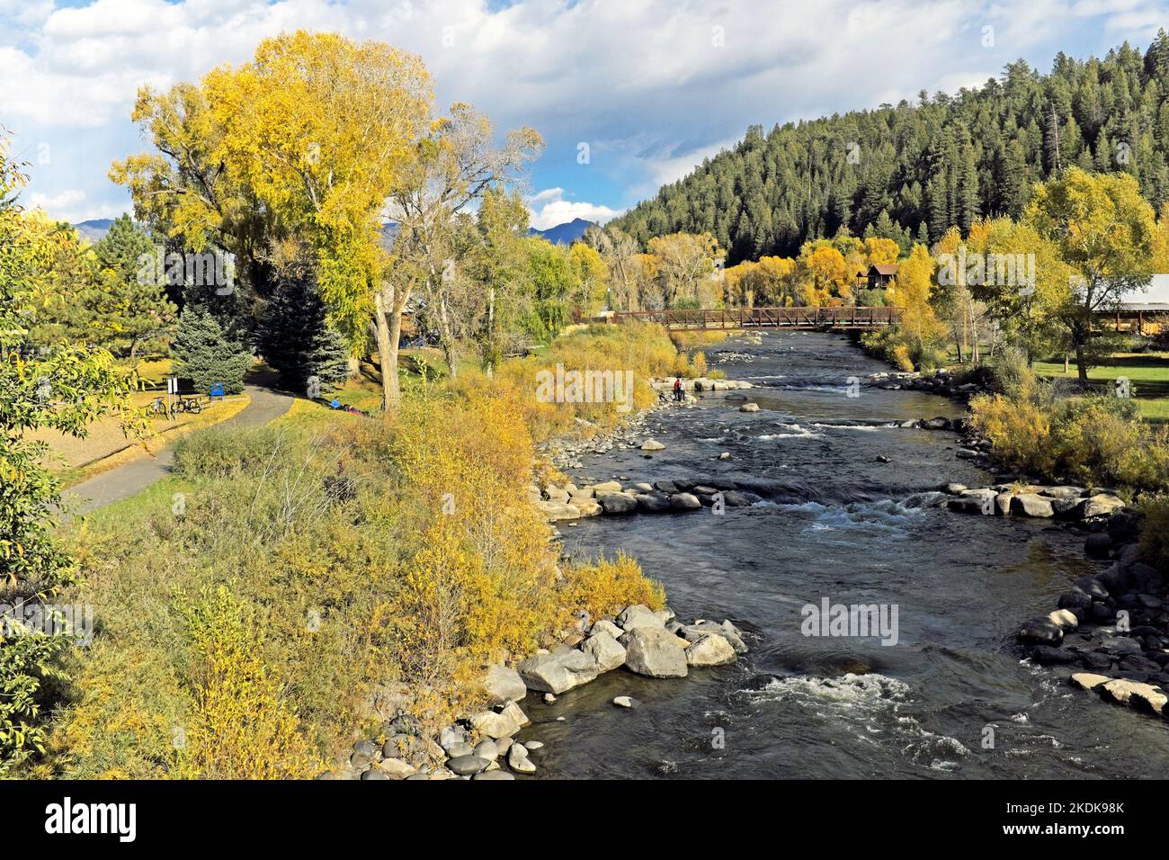 The San Juan River flows through the fall landscape in the San Juan Mountain town of Pagosa Springs, Colorado, USA on October 11. 2022. Stock Photo