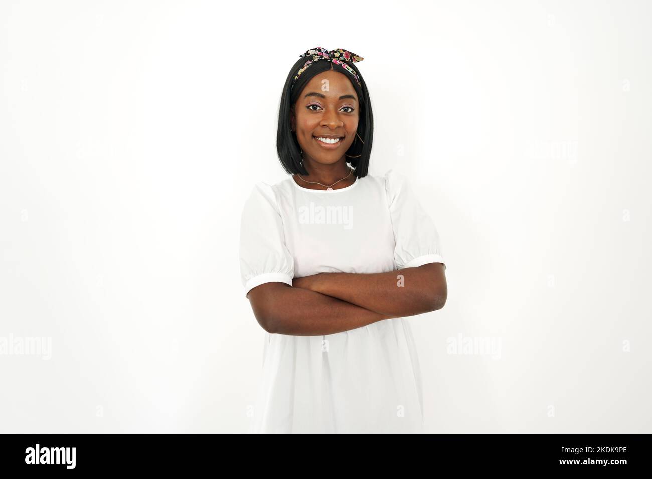 Beautiful young african woman posing over white background Stock Photo ...