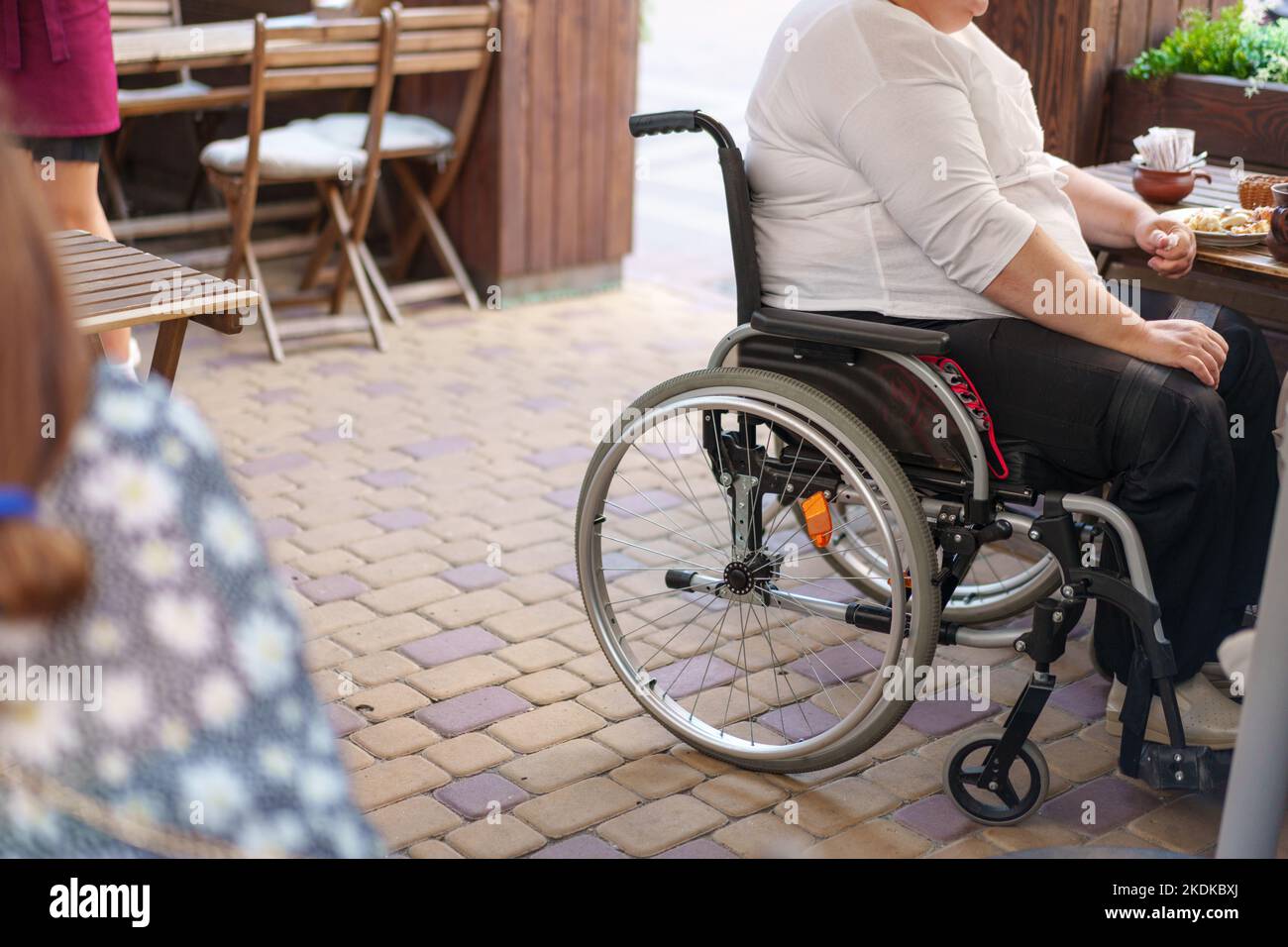 Woman who uses a wheelchair hi-res stock photography and images - Alamy