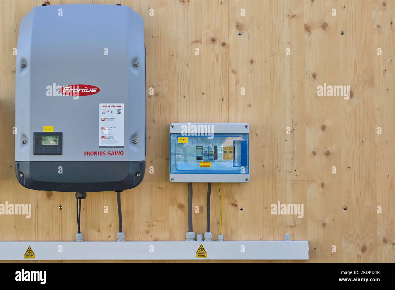 Almere, The Netherlands - April 21, 2022: Wooden wall with new solar panel inverter and battery charger system in Almere, The Netherlands Stock Photo
