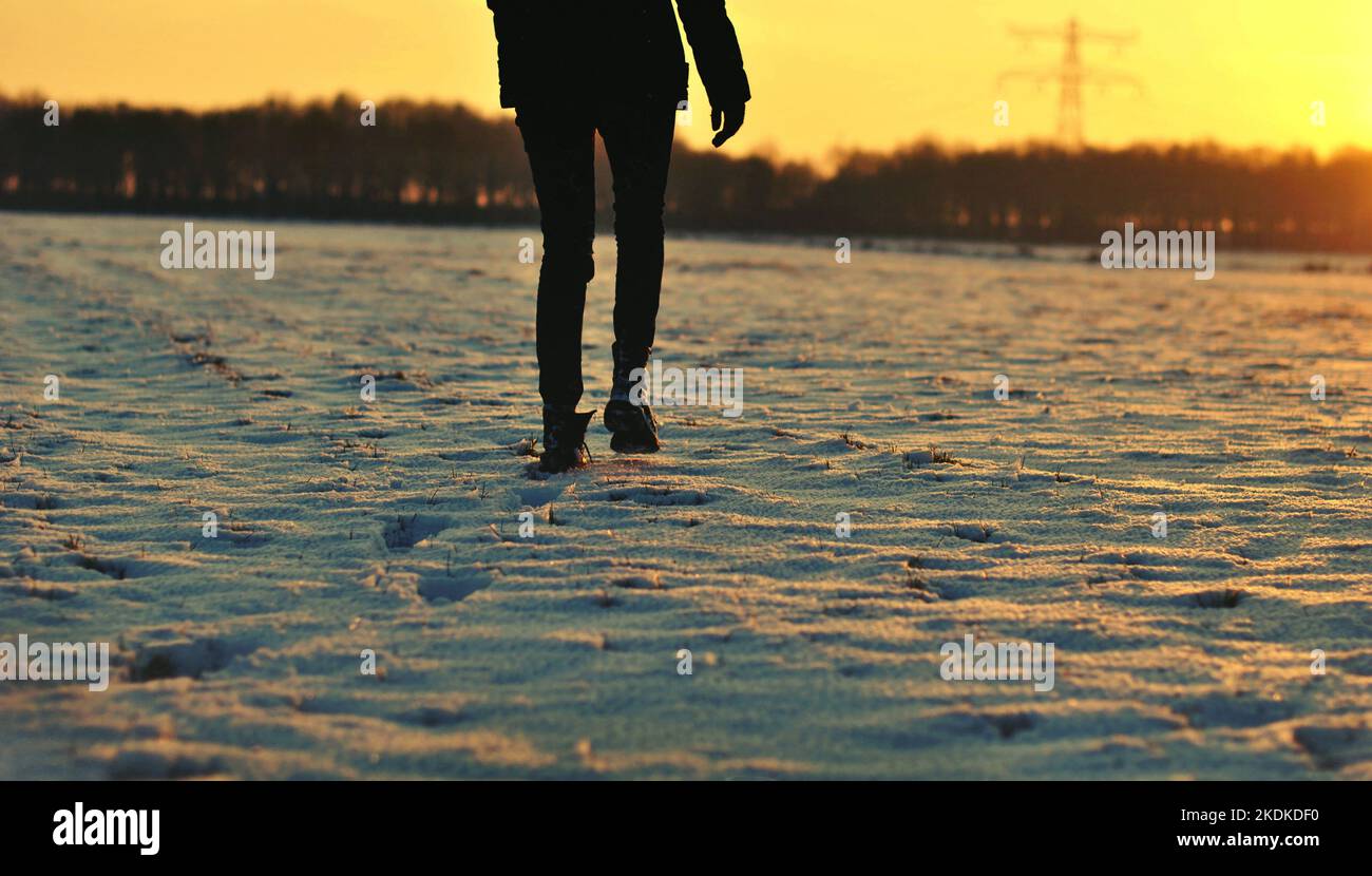 Girl in snow walking alone hi-res stock photography and images - Alamy