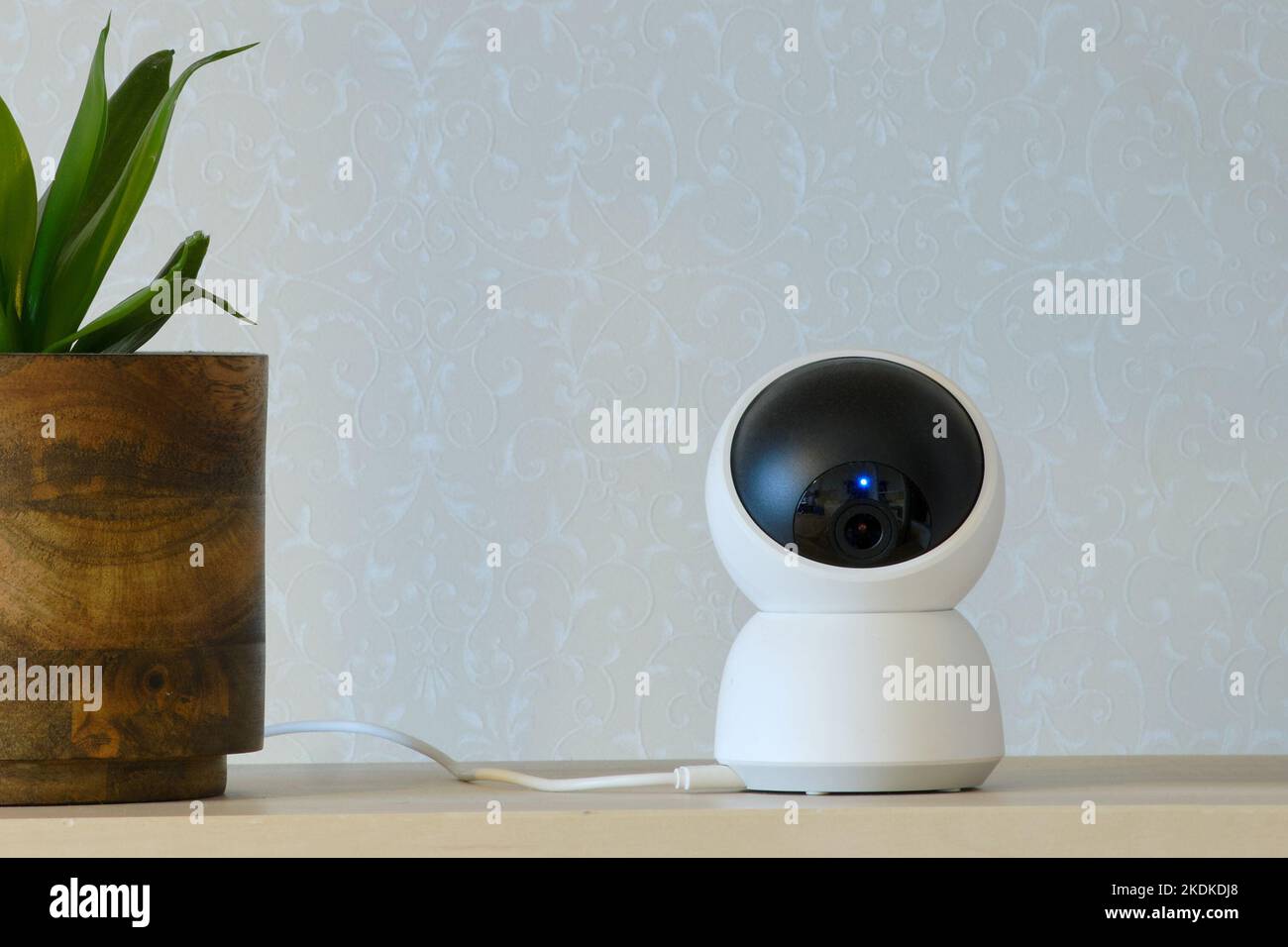 Home surveillance online camera, living room white background Stock