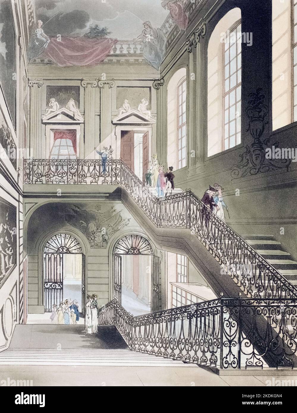 The hall and stair case, British Museum.  Circa 1808.  After a work by August Pugin and Thomas Rowlandson in the Microcosm of London, published in three volumes between 1808 and 1810 by Rudolph Ackermann.   Pugin was the artist responsible for the architectural elements in the Microcosm pictures; Thomas Rowlandson was hired to add the lively human figures. Stock Photo
