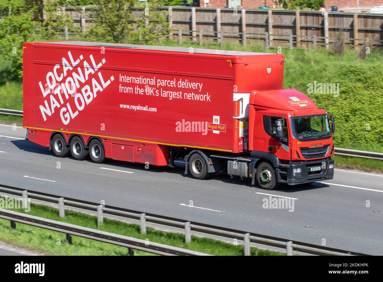 Local National Global Royal Mail Haulage delivery trucks, lorry, transportation, truck, cargo carrier, DAF vehicle, European commercial transport, industry, M6 at Manchester, UK Stock Photo