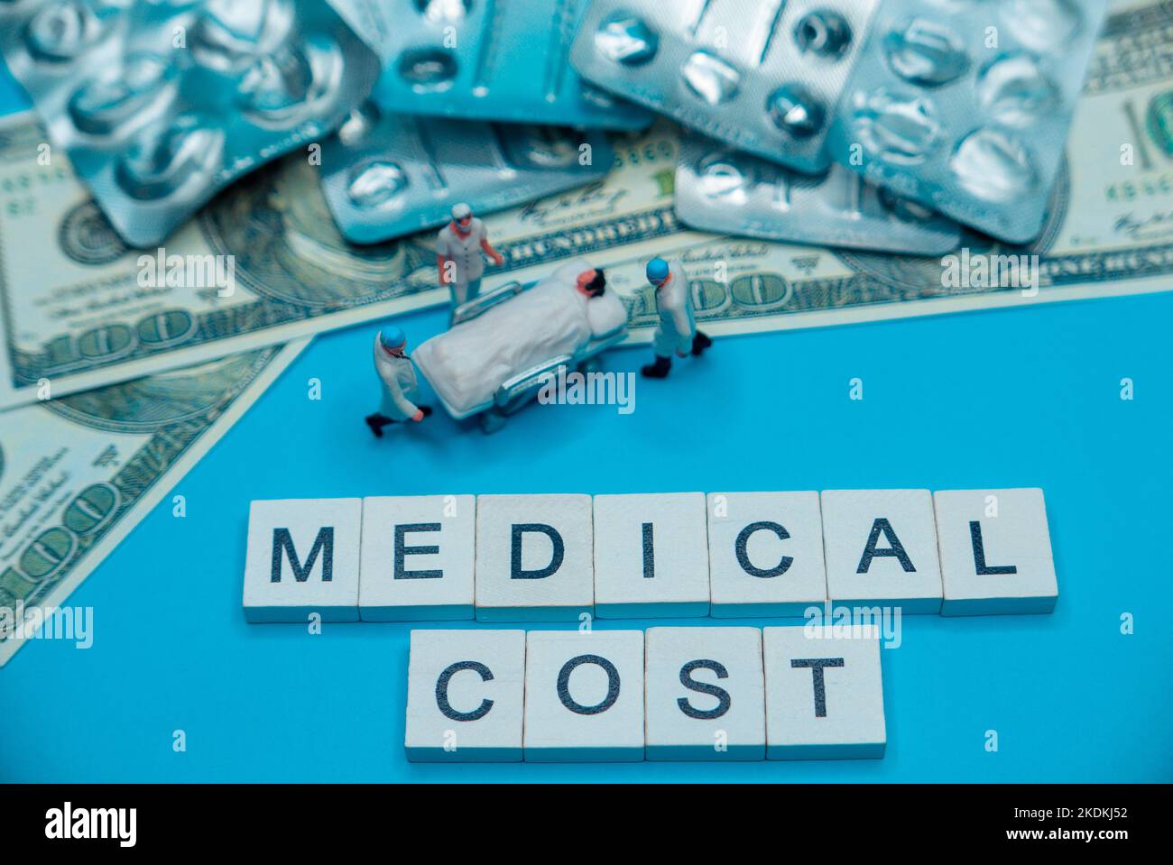 Miniature medical toy people - costly medical expenses concept. Stock Photo