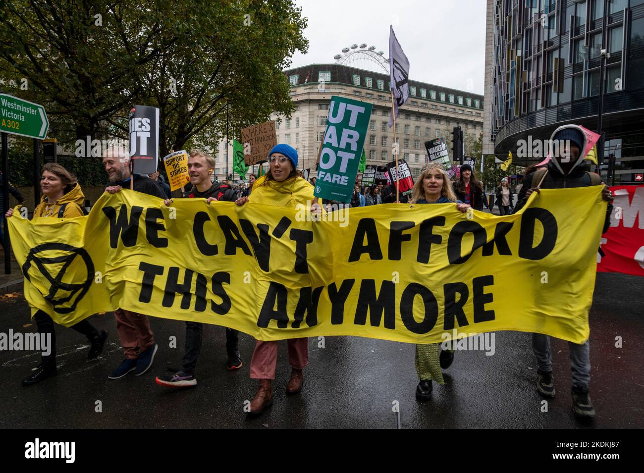 Extinction Rebellion activists protesting that we cannot afford climate change and the destruction it will bring at a demonstration in London UK. Stock Photo