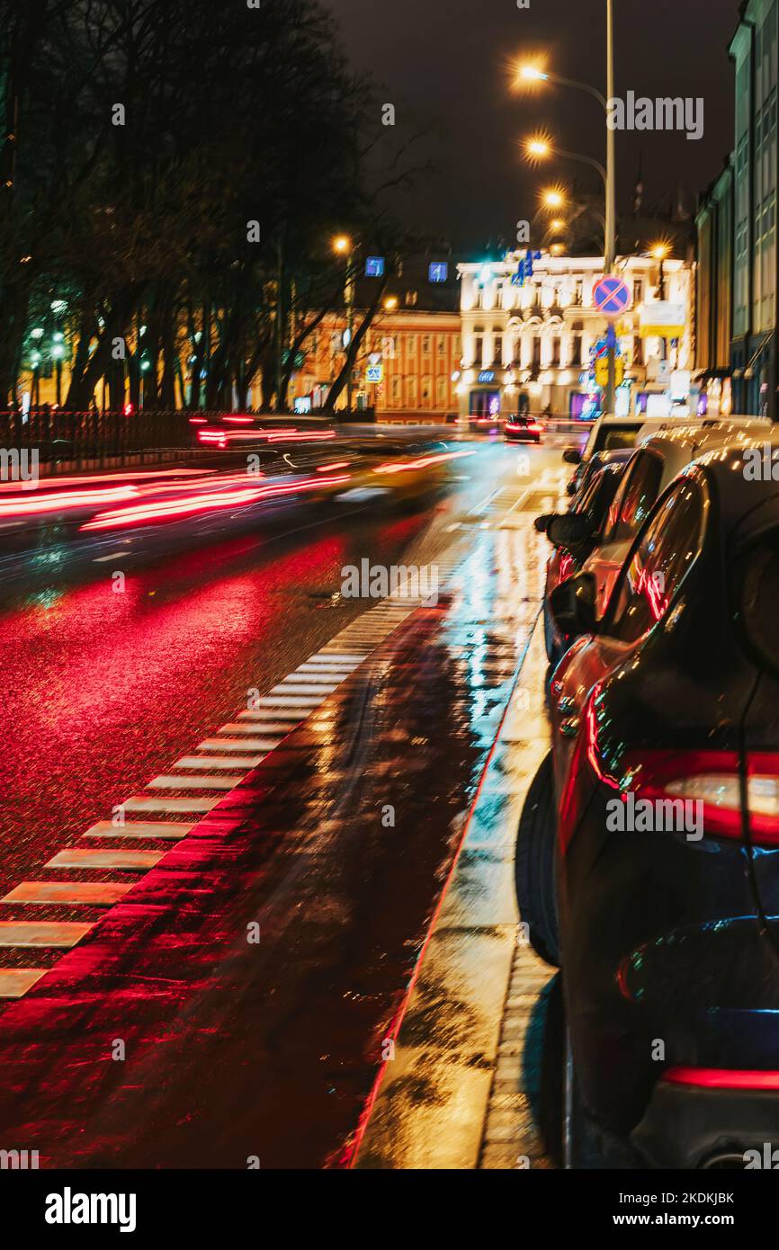 Urban street evening traffic. Blurred auto, city street lights and traffic jams. Abstract blur background Stock Photo