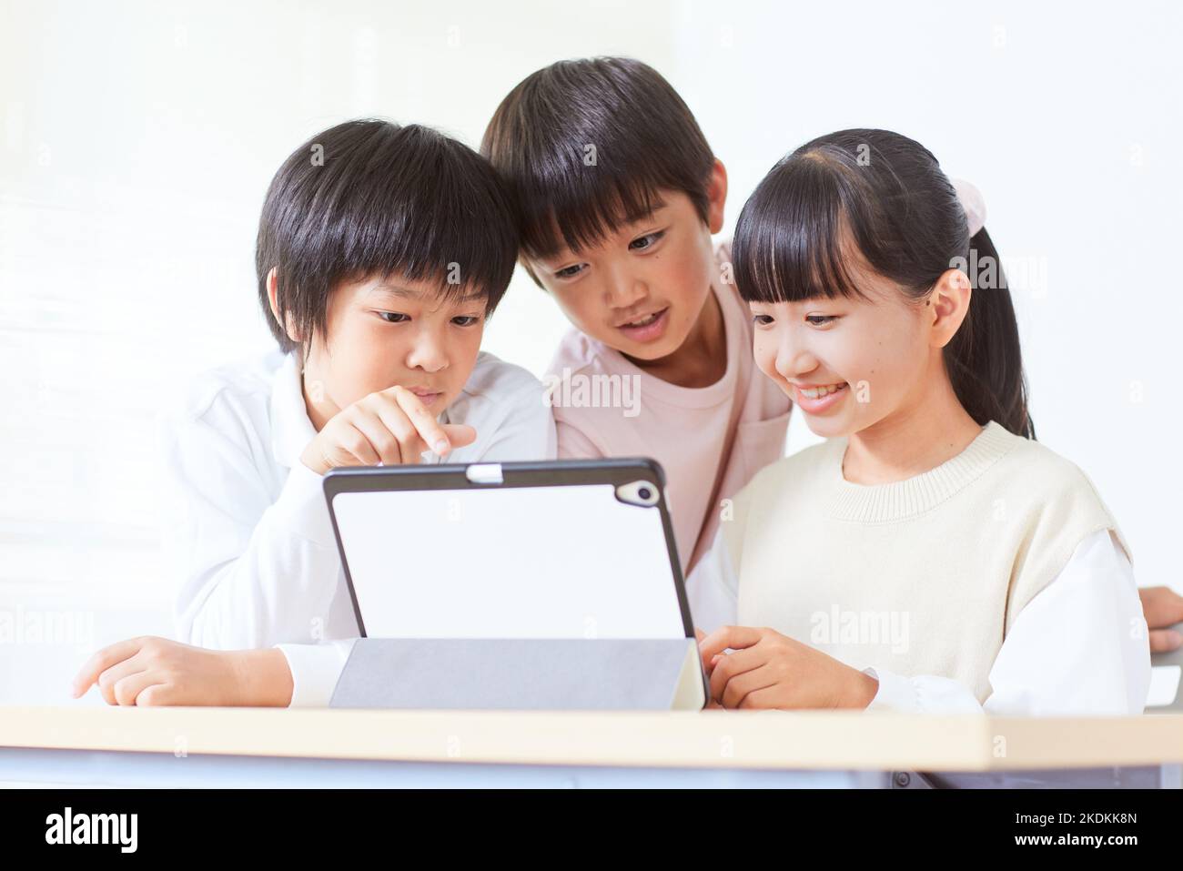 Japanese kids using tablet Stock Photo