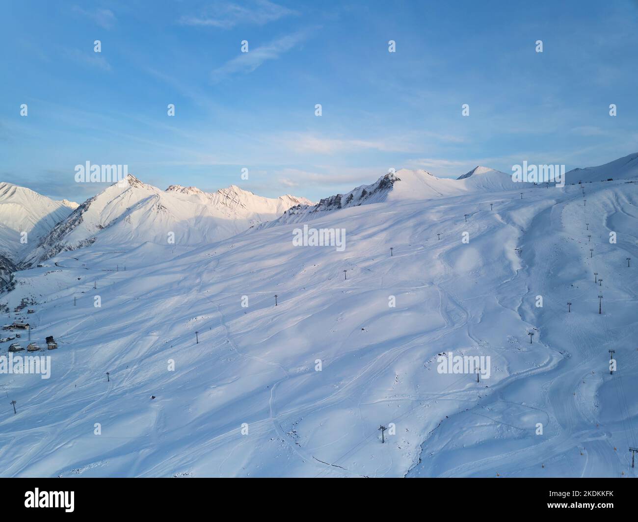 Aerial of snowy mountain slopes full of powder for freeride at ski ...