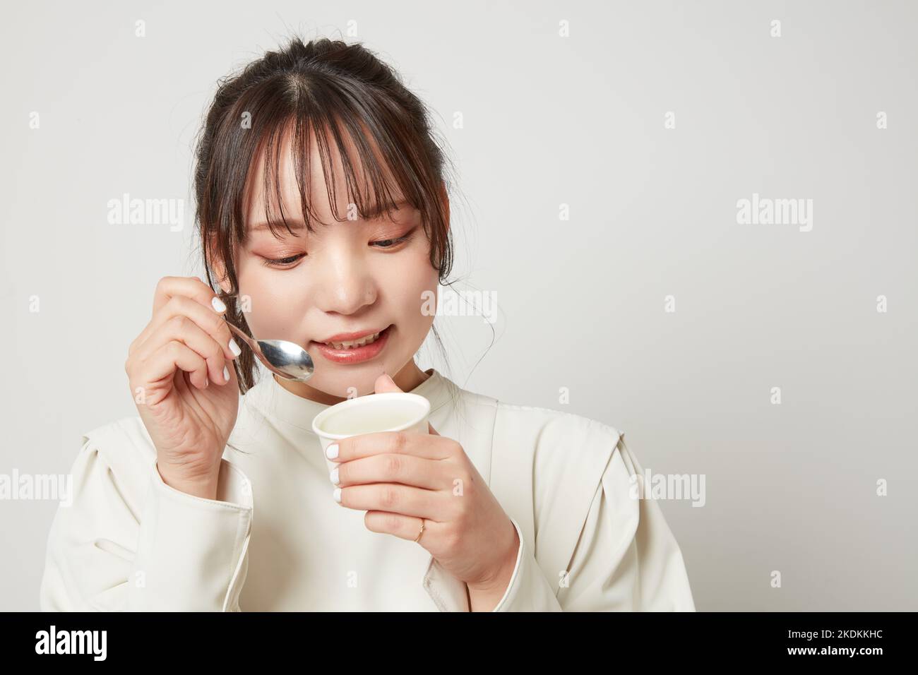 Young Japanese woman eating ice cream Stock Photo Alamy