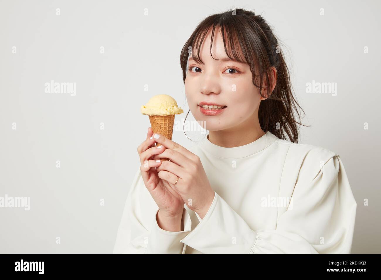Young Japanese woman eating ice cream Stock Photo Alamy