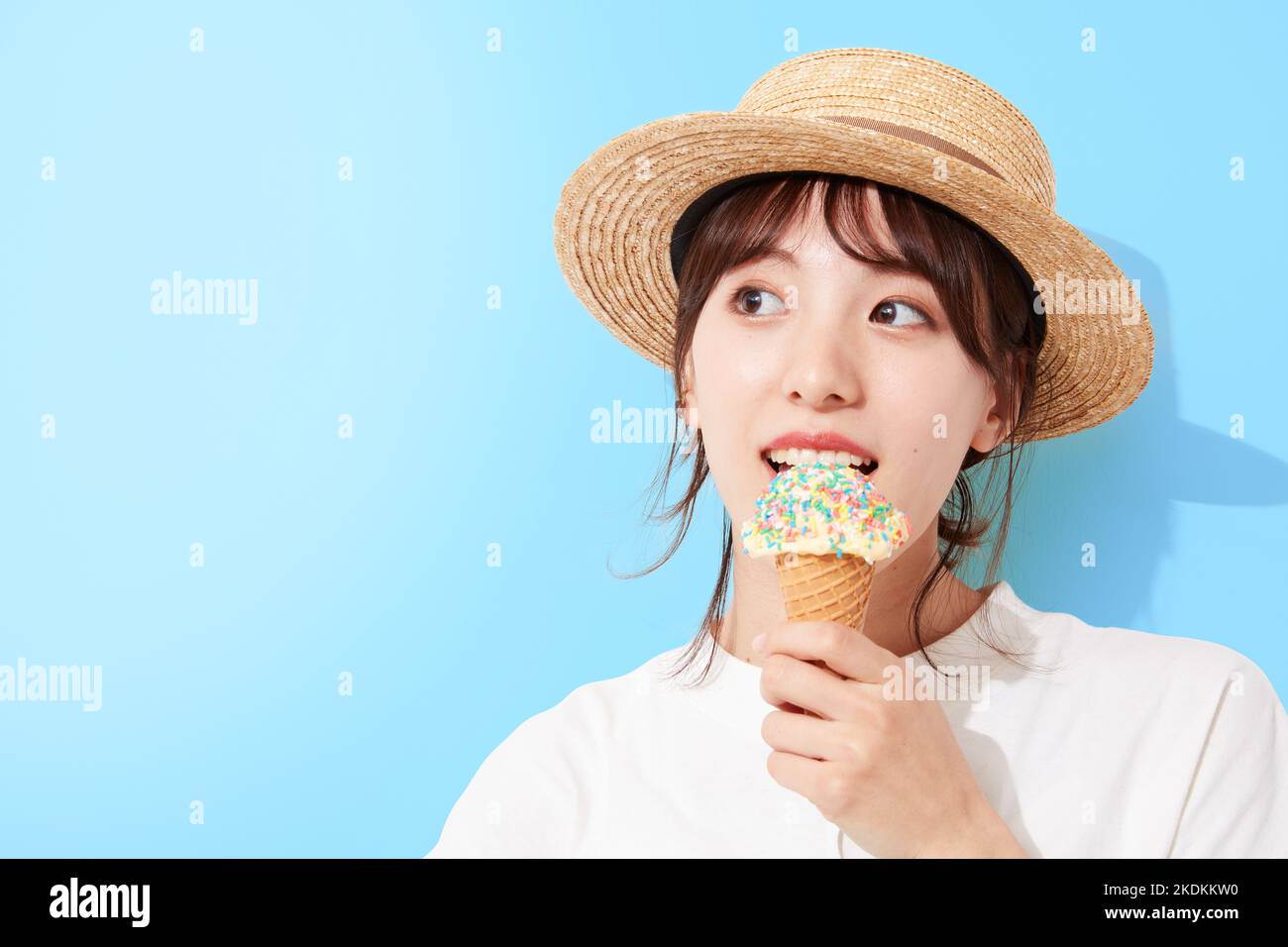 Young Japanese woman eating ice cream Stock Photo Alamy