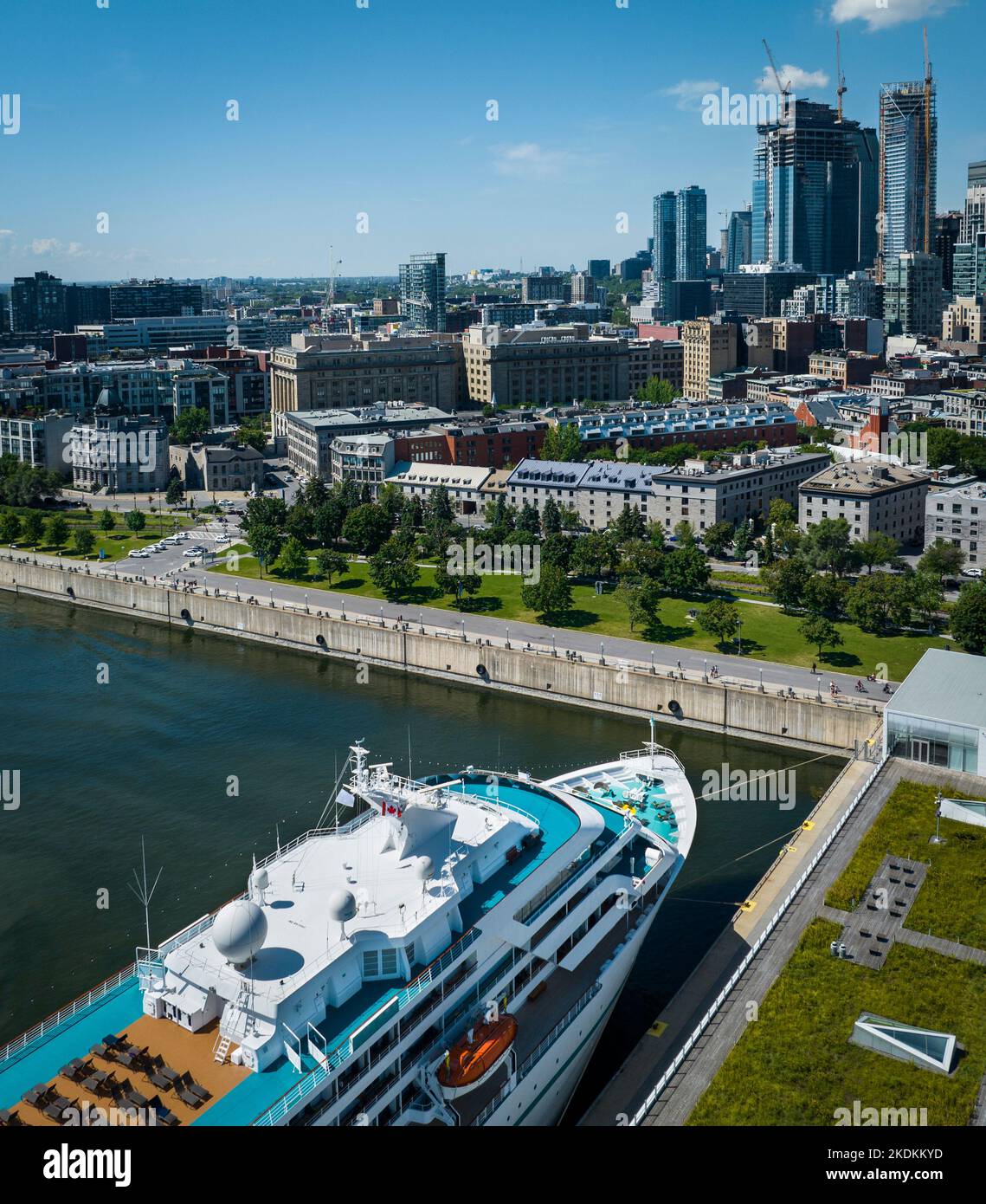 Cruse ship moored at the Montreal Port with a view on the city downtown. Stock Photo