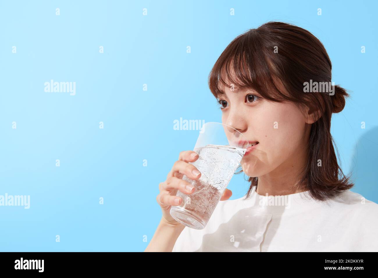 Young Japanese woman drinking water Stock Photo Alamy