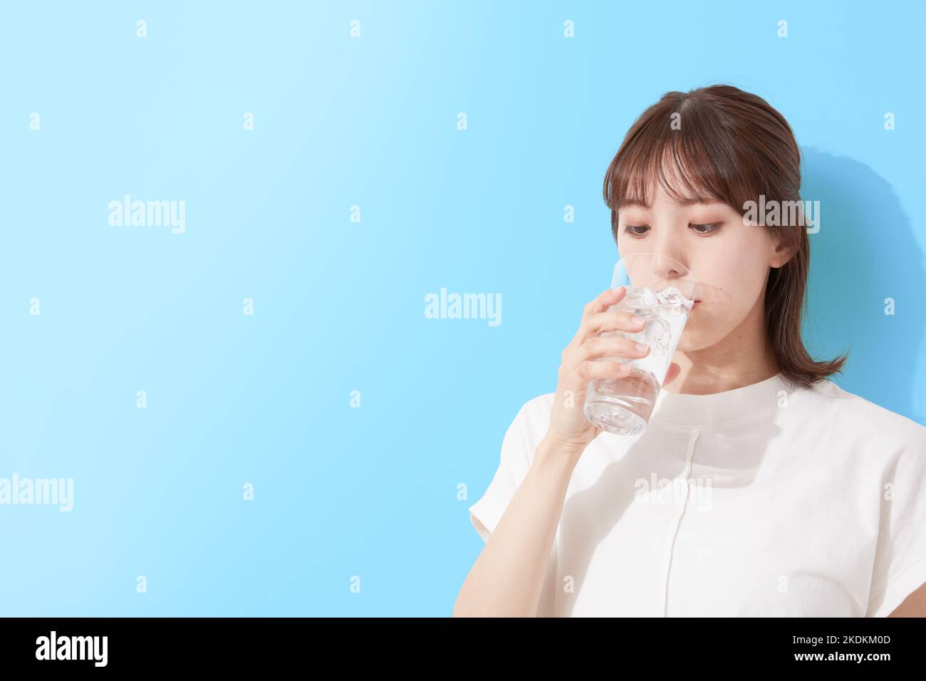 Young Japanese woman drinking water Stock Photo Alamy