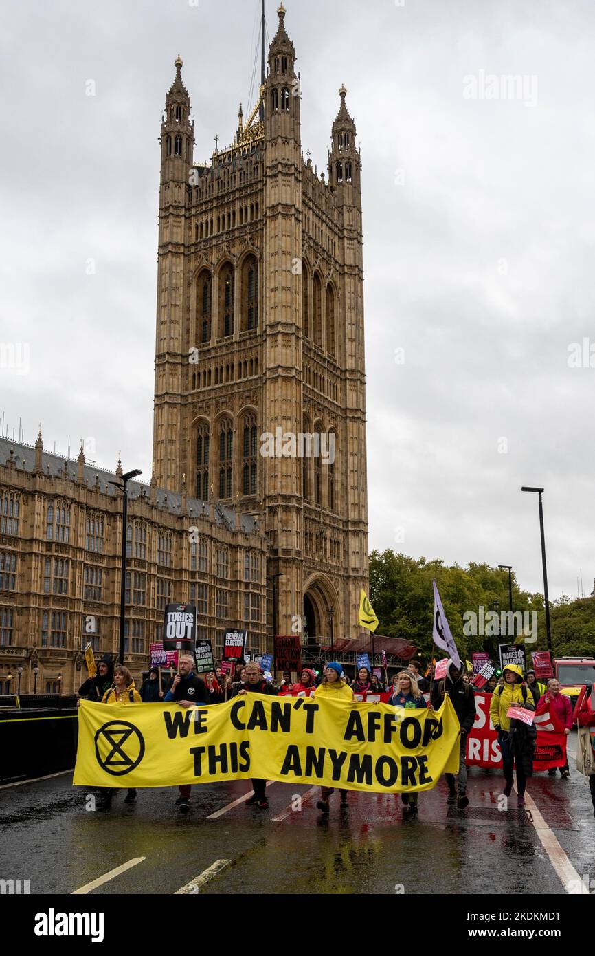 Extinction Rebellion activists protesting that we cannot afford climate change and the destruction it will bring at a demonstration in London UK Stock Photo