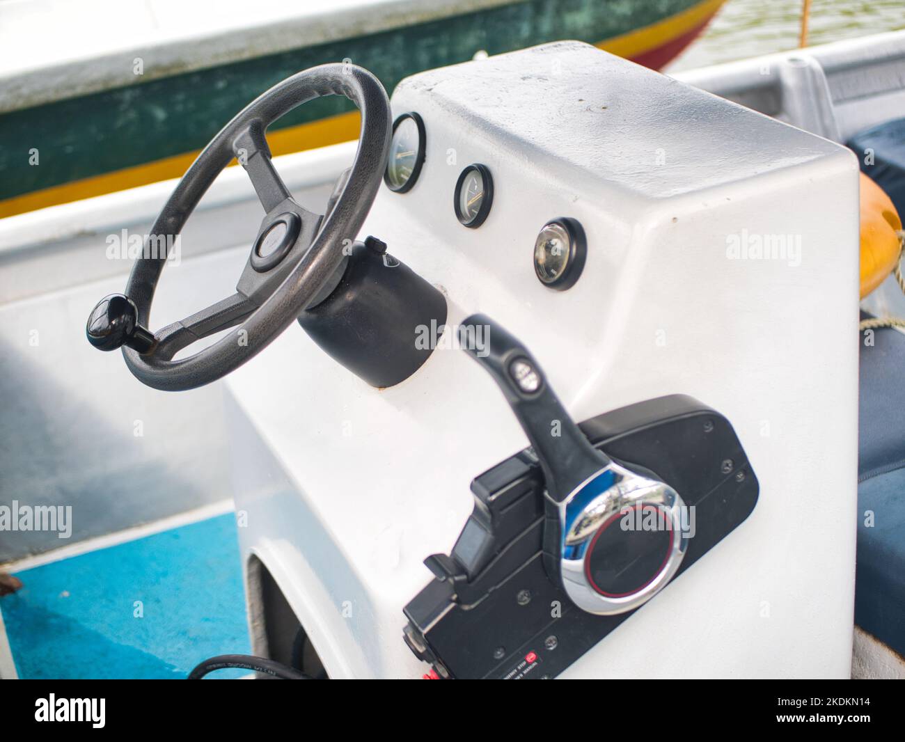 A boat steering wheel and lever with instrument panel Stock Photo