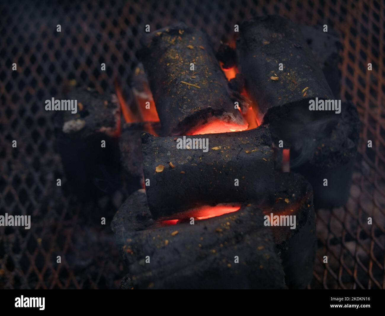 Burning and glowing charcoal briquette for barbecue grill Stock Photo