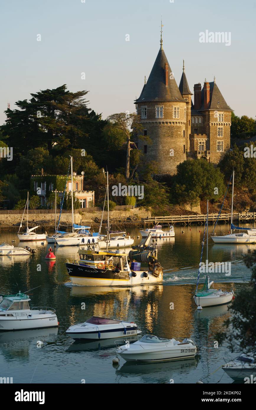 France, Pays de la Loire region, Loire-Atlantique, Pornic, castle and trawler leaving the port, harbour, port Stock Photo