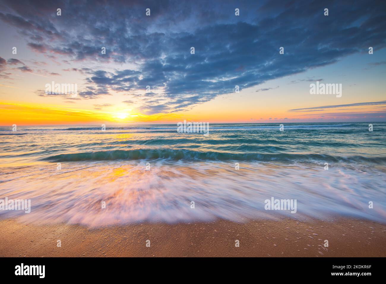 Beach sunrise over the tropical sea Stock Photo - Alamy