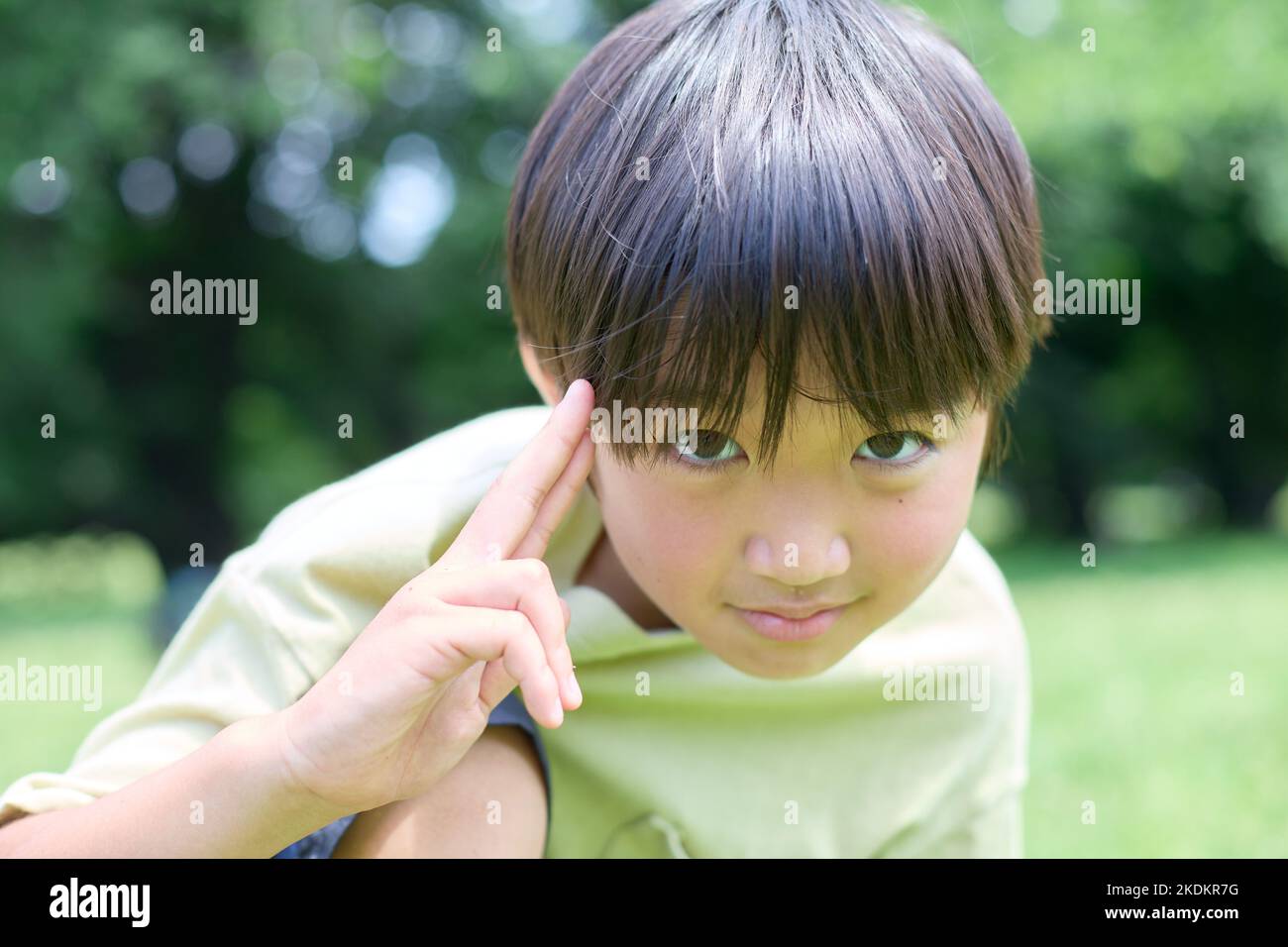 Japanese kid at city park Stock Photo