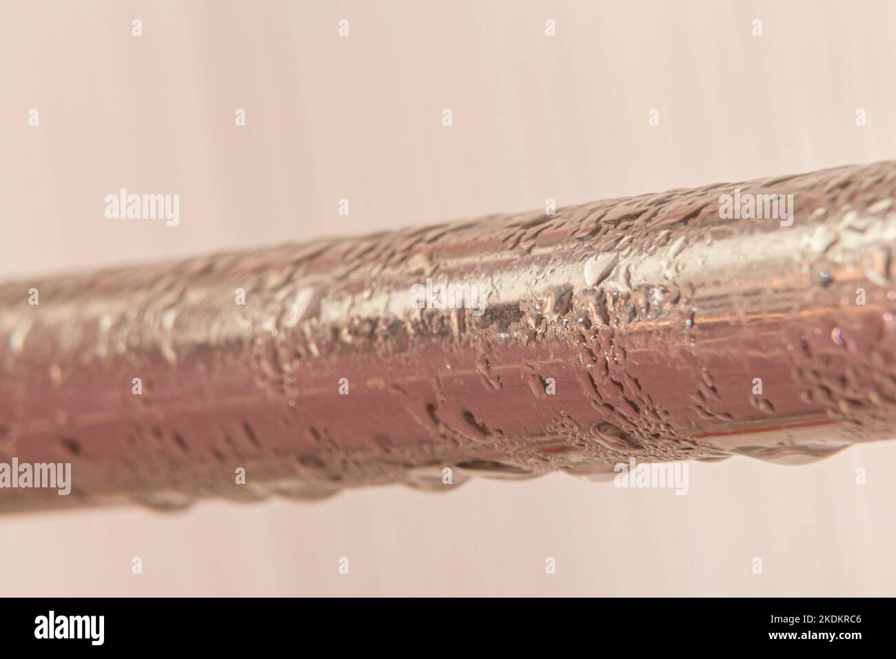 condensate on a steel pipe. Water accident and leak concept Stock Photo