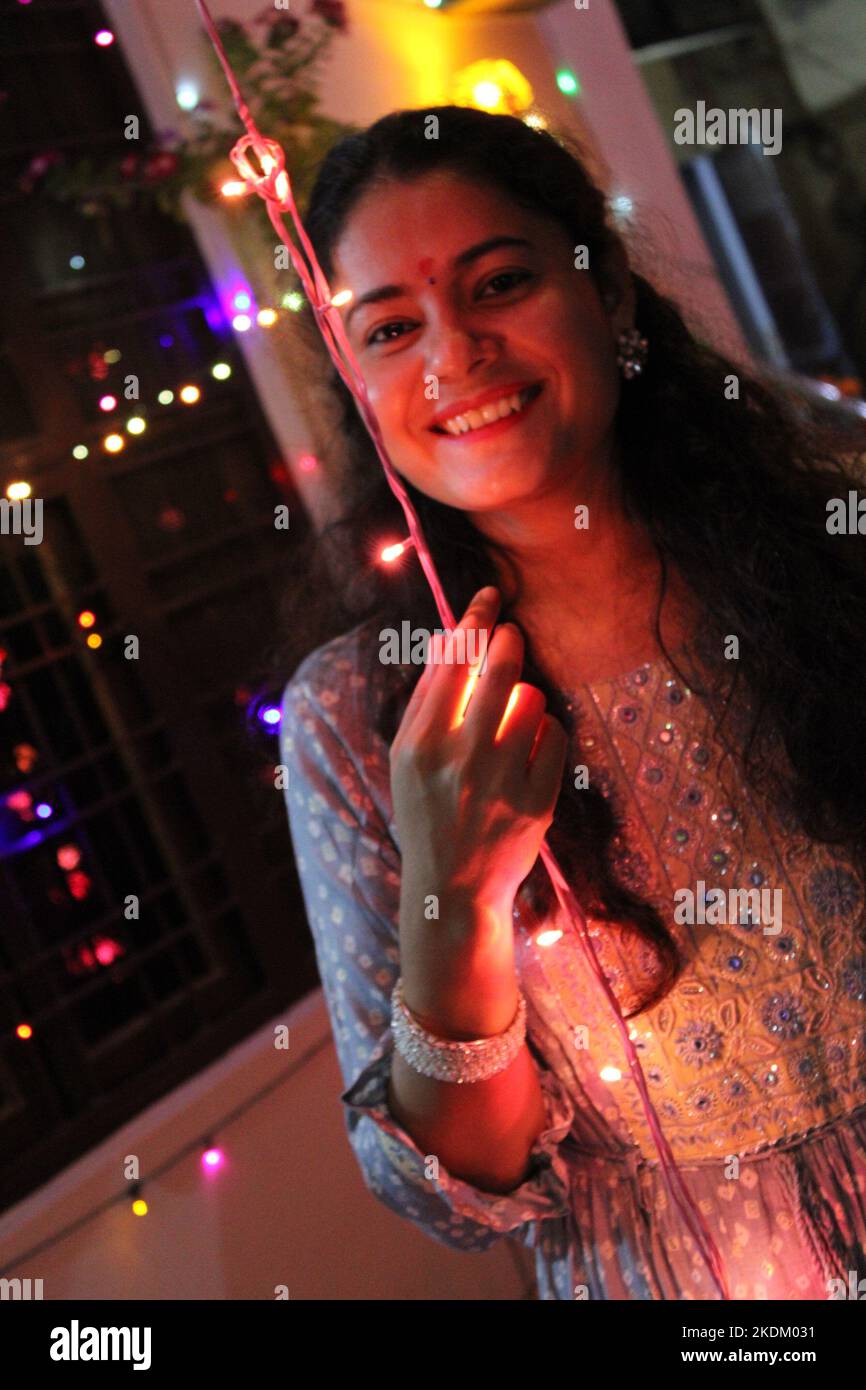Family celebrating diwali at home with full of happiness Stock Photo