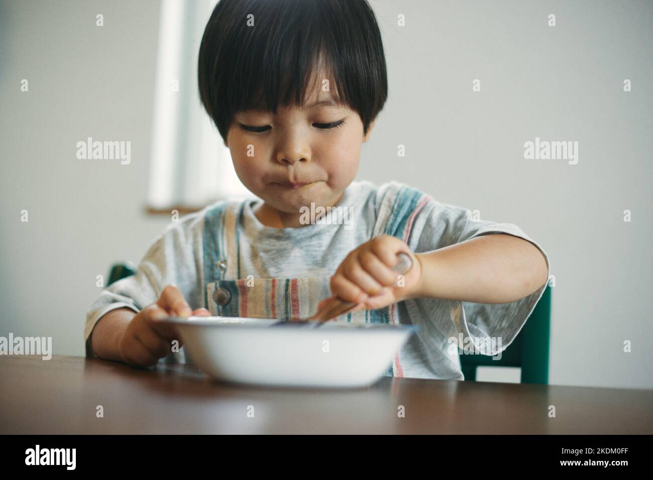 Asian boy eating rice hi-res stock photography and images - Alamy
