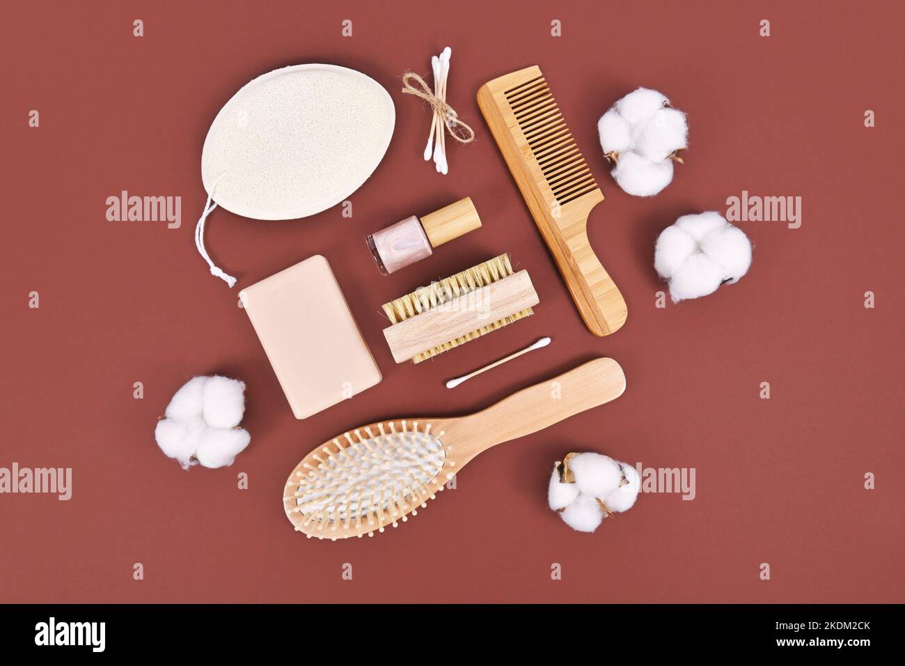 Eco friendly wooden beauty and hygiene products like comb and soap on brown background Stock Photo
