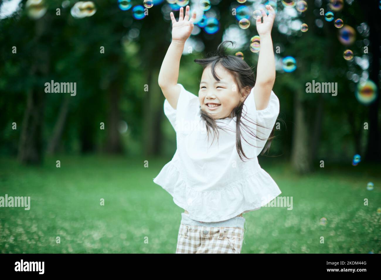 Japanese kid at city park Stock Photo