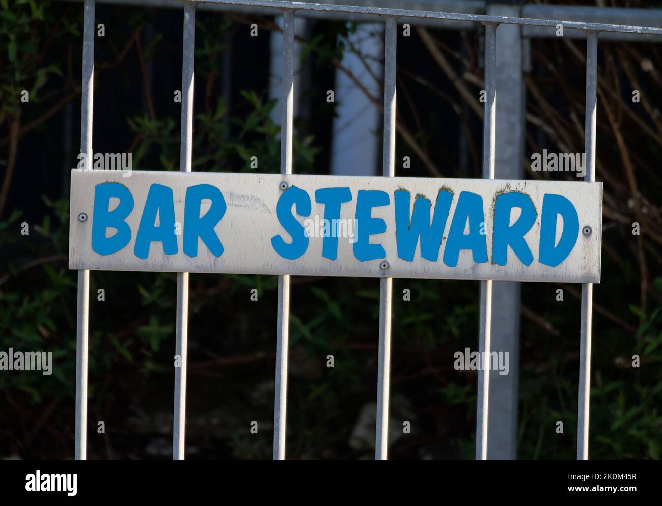 Metal Bar Steward Sign Attached To A Railing, A Euphemism For Bastard