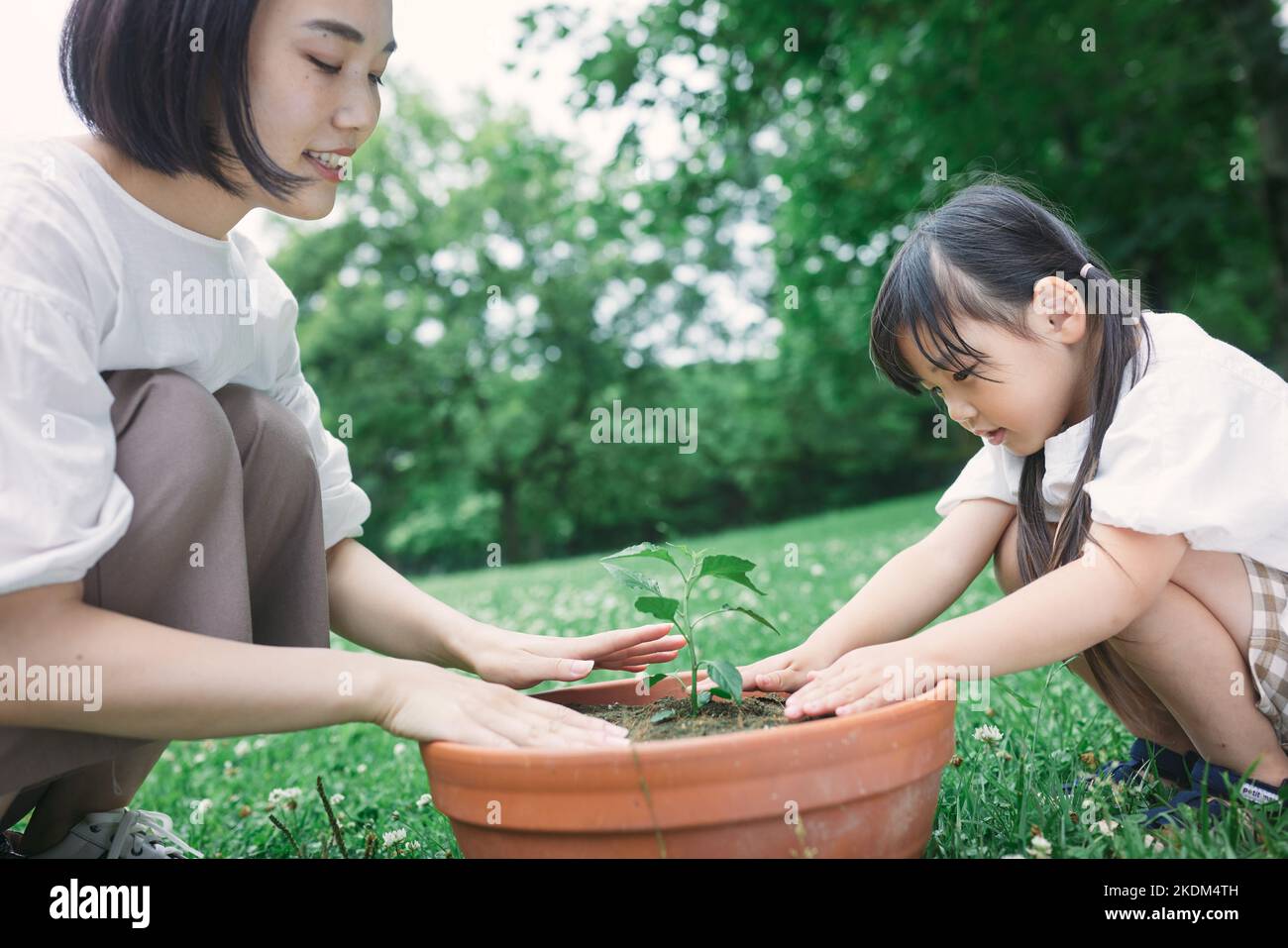 Japanese kid with her mother at city park Stock Photo