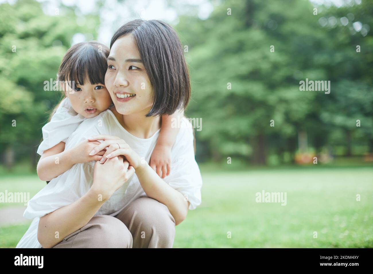 Japanese kid with her mother at city park Stock Photo